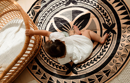 Baby sitting on the Bassy playmat by PELE – a Polynesian-designed baby playmat